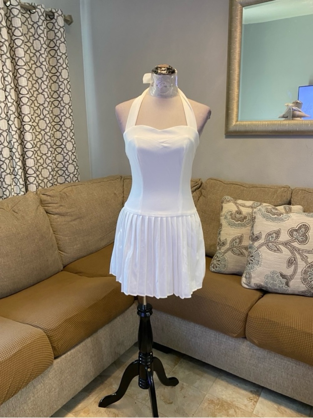 New Women Small white halterneck mini dress features a distinctive pleated skirt
